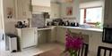Kitchen area shwoing the wheelchair adapted hob and sink at Sparham Hall Farm Holidays