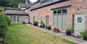 Garden and front door to Sandhole Cottages