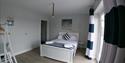 Double bed at Coastal Cottage