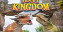 Two dinosaur sculptures, one with horns and the other with sharp teeth, in front of a "Lost Kingdom" sign. The scene is vibrant and playful.