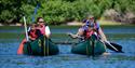 Family kayaking on the water at Calvert Exmoor
