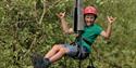 Person posing on abseiling ropes at Calvert Exmoor