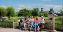 Family with a pushchair sitting down at WWT Slimbridge Wetland Centre