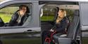 woman and man in a wheelchair accessible vehicle