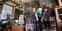 Visitors exploring the house at Calke Abbey