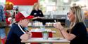 A woman and small child sat at the cafe drinking tea at Strawberry Field