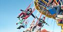 A group of children on a carousel ride at Crealy Theme Park & Resort