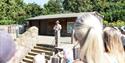 Deaf Led BSL Tour at London Zoo – Group of people watching a Deaf Presenter signing