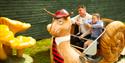 Father and daughter on board a snail carriage