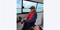 man steering at boat with Wetwheels Jersey