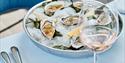 oysters served with wine at Sumas Restaurant