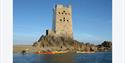 tower on the beach with kayaks pulled up alongside it with Jersey Kayak Adventures Ltd