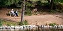 Couple sitting with a lakeside view at Mallards Pike