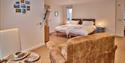 The Rings twin bedroom  with a chair and breakfast table