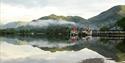 Views across the water with the mountains in the background at Troutbeck Head