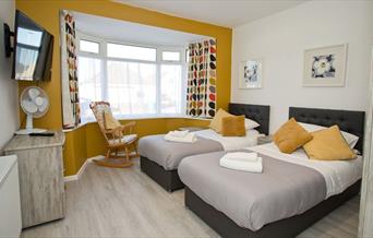 yellow and grey bedroom