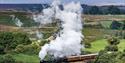 Steam train travelling through the beautiful North York Moors National Park
