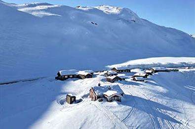 Mountain lodge with cabins in the mountains during winter