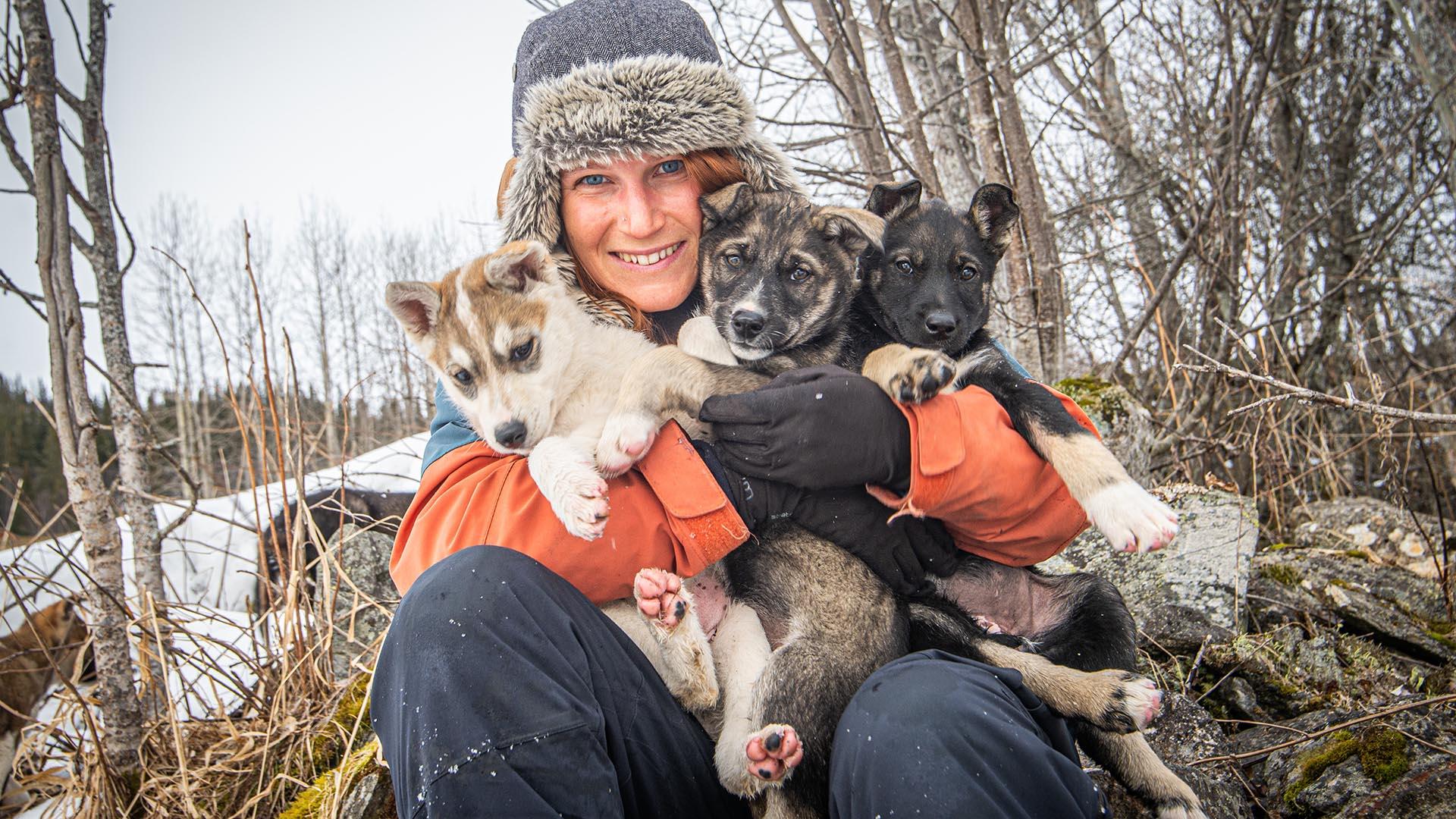 Woman with puppies.