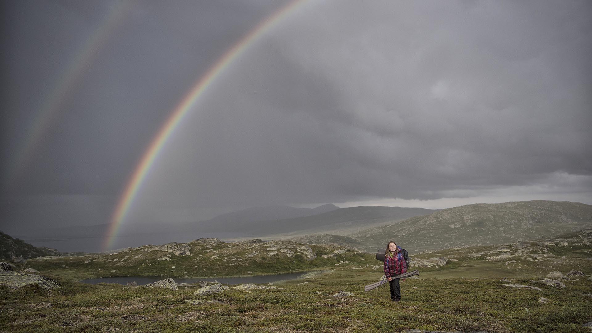 On the way to fishing, with a rainbow in the background.