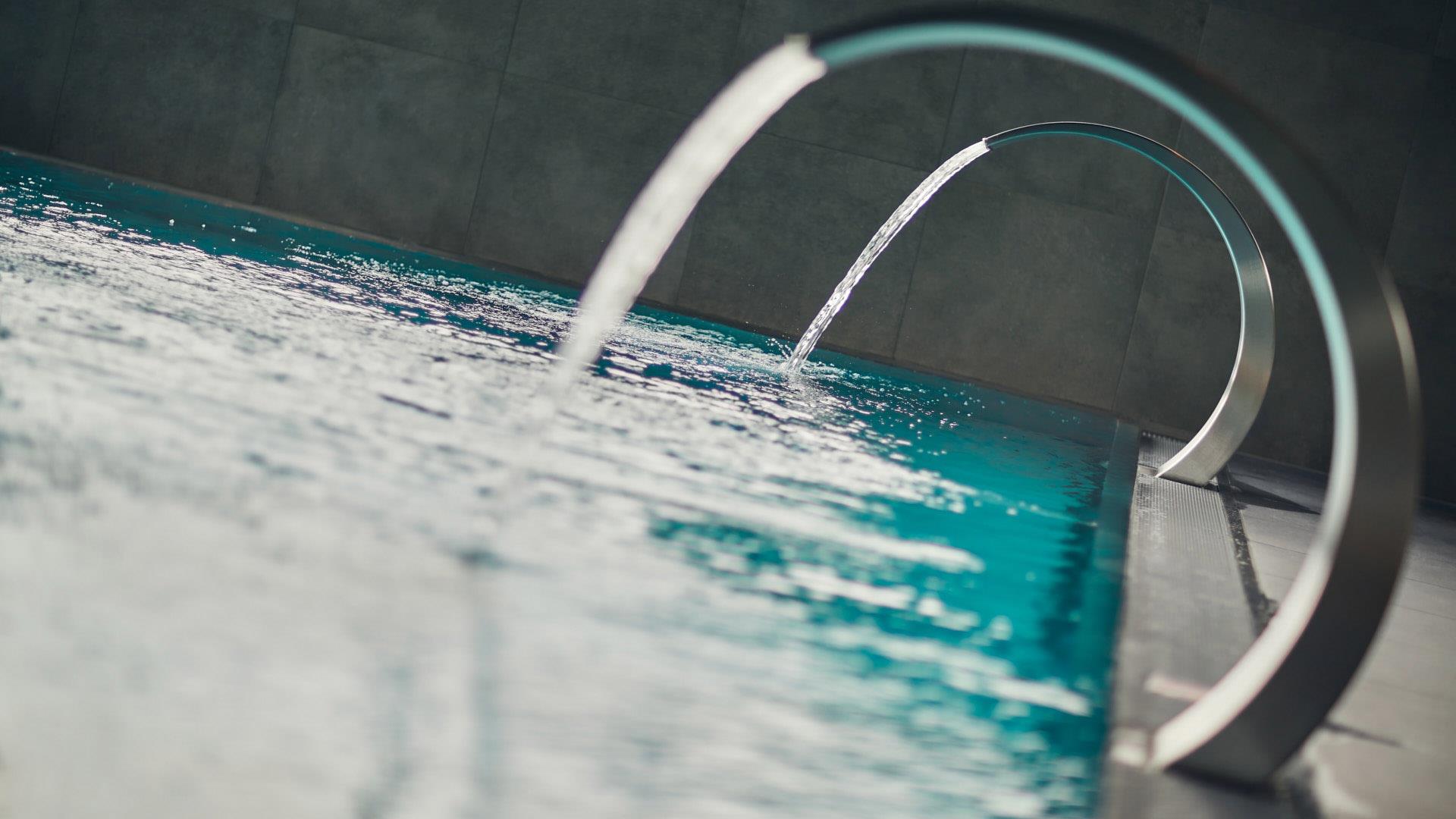 A swimming pool with massaging waterfalls