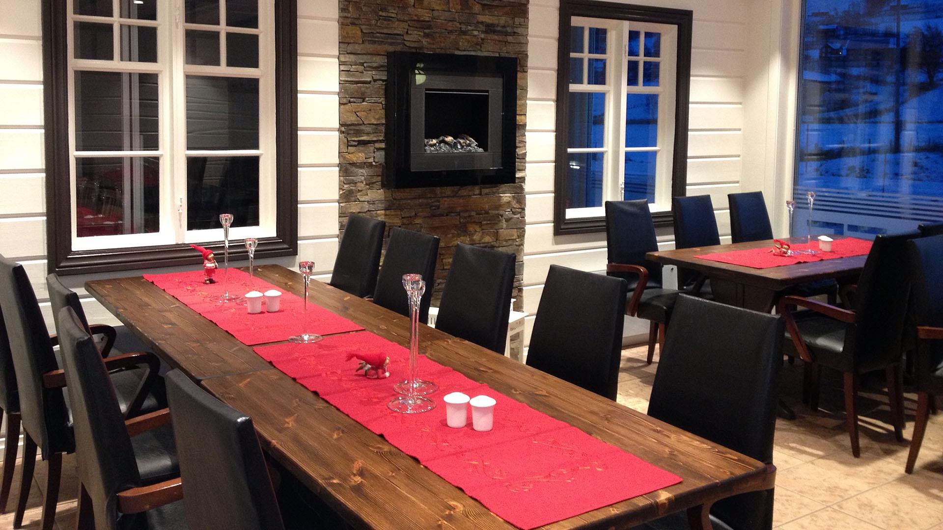 Table with red cloth at a cafe ready to welcome guests.