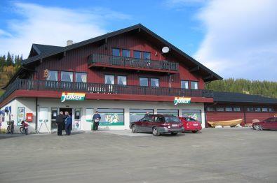 Convenience store located in i red painted Swiss style building.