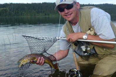 River fisherman with a trout.