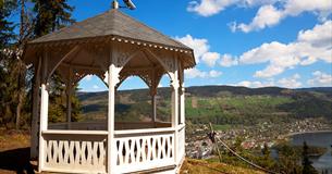 White wooden pavillion on a viewpoint overlooking Fagernes