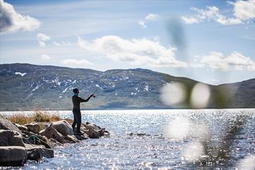 Fishing from the shore of Lake Vinstre.