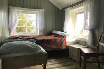 Et grønt soverom i Olavstøga.