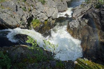 The River Hinøgla forms the Waterfall Staupfossen right by the road through the Valley Murudalen.
