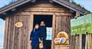 Sign that says: Honesty shop 24/7. Farm shop in the background