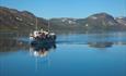 M/B Bitihorn på speilblanke Bygdin en solskinnsdag