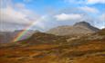 The mountain Bitihorn behind a rainbow