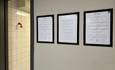 Three pictures on the wall. The pictures display rules and symbols