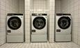 Three washing machines available for use at Bergo Laundry