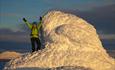 A happy skier on the summit of Skaget.