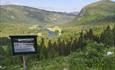 Information board along the cultural path to Kverrvilljuvet gorge, with a view to Begnadalen valley.