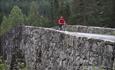 Cyclist in red jacket on Lunde Bridge