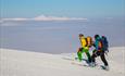 Ski ascend towards Rasletinden with the mountain Nautgardstinden in the background.