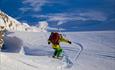 Powder downhill run from the summit of Rasletinden.