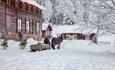 Horse and sleigh in the farm yard at Piltingsrud in the snow.