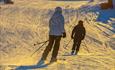 Skiers in the evening sun at Valdres Alpinsenter in Aurdal.