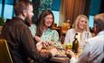 Two couples at a dining table