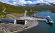 Cafe Gjendeosen from a bird's-eye view with the Gjendeboat at the dock.