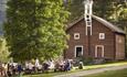 An outdoor banquet in the farm yard of Piltingsrud in summer.