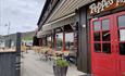 the sunny outside sitting area of Peppes Pizza at Beitostølen