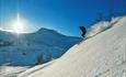 Off-piste skiing pleasure in powder snow down the slopes of Stølsnøse.