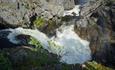 The River Hinøgla forms the Waterfall Staupfossen right by the road through the Valley Murudalen.